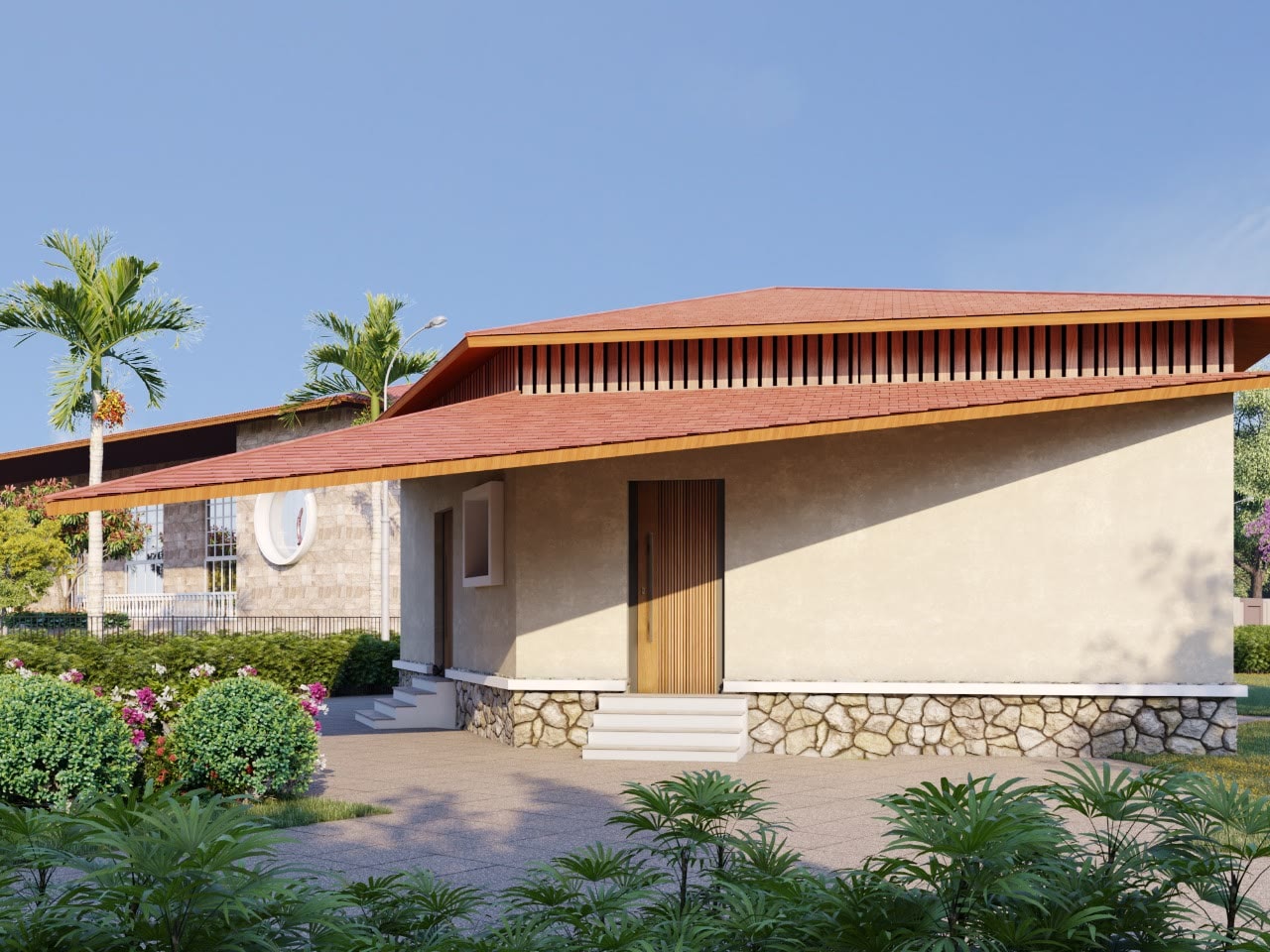 A farmhouse at Tadoba Aranyavas, set among palms and flowering gardens
